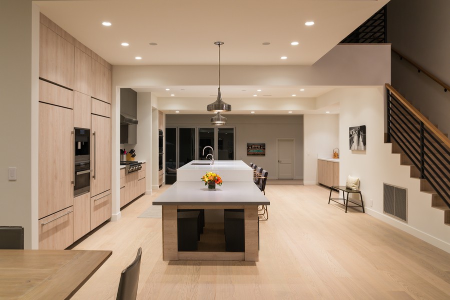 A living space featuring a Savant wall panel for lighting control and more.