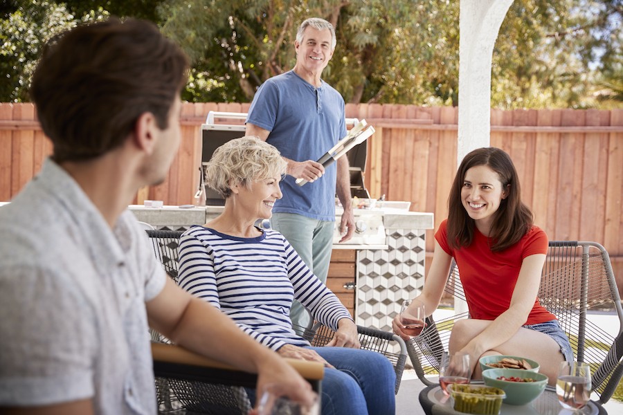  A family enjoying a cookout in their backyard.