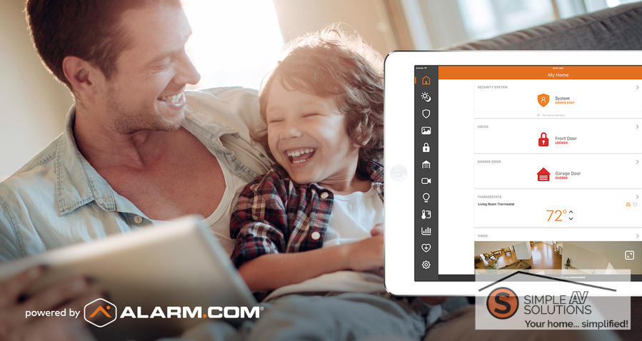 Father and son laughing together on a couch, with a tablet displaying an Alarm.com smart home app interface for managing security, locks, and thermostat settings with the Simple AV Solutions logo in the corner.