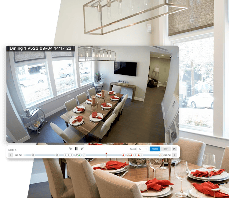 A stylish dining area captured by Alarm.com’s indoor security camera with a timeline interface for reviewing recorded footage.