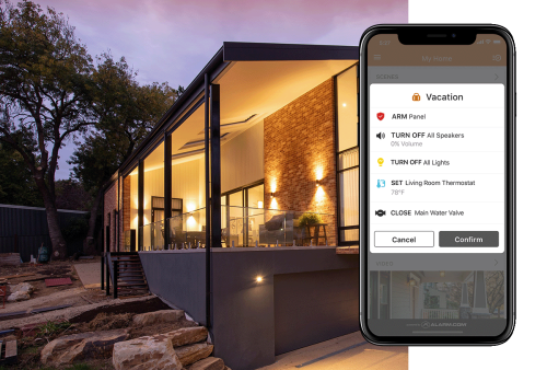 A scenic outdoor view of a home featuring Alarm.com’s automated security and lighting controls for safety and convenience.