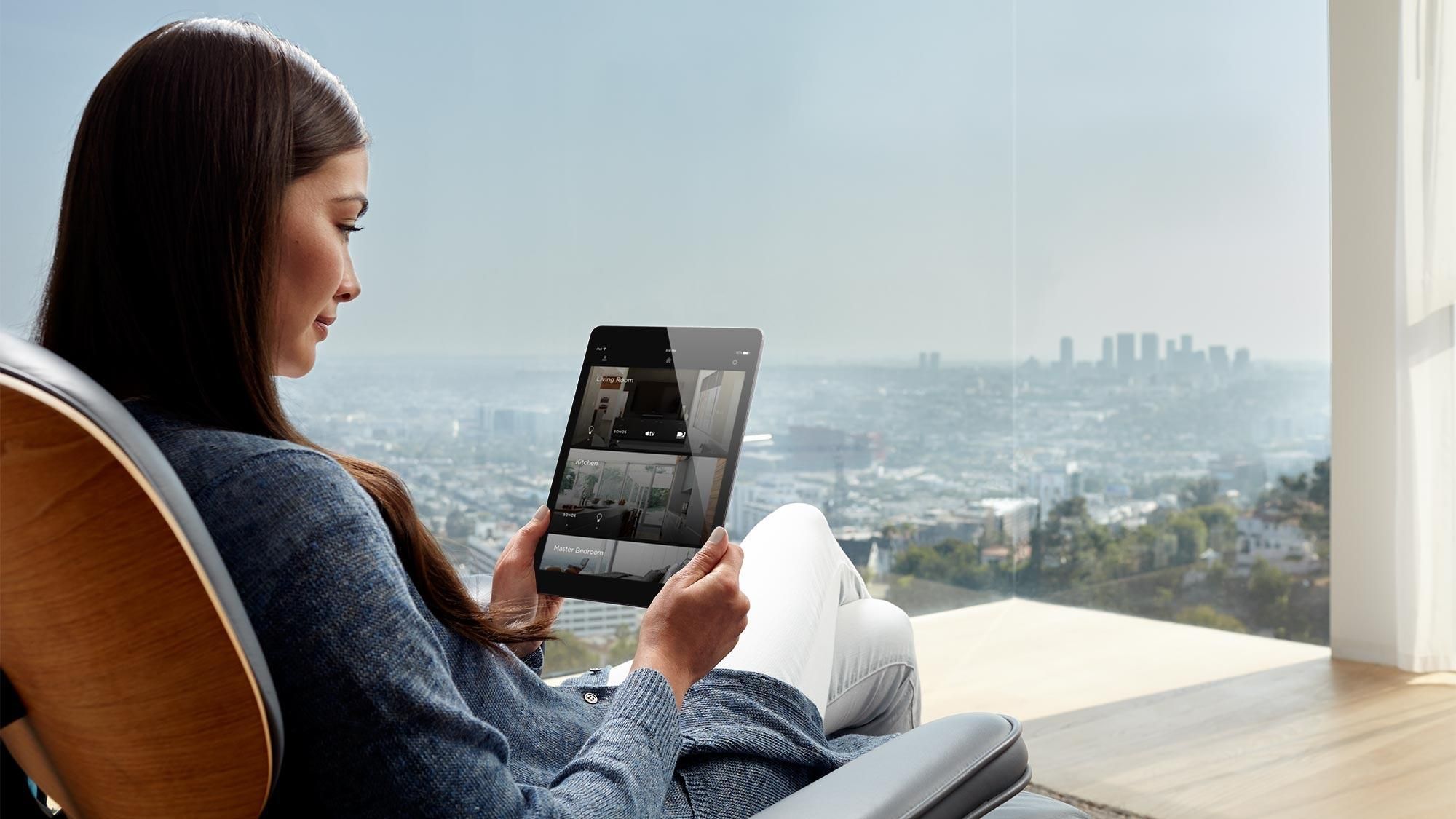 woman holding ipad with savant interface